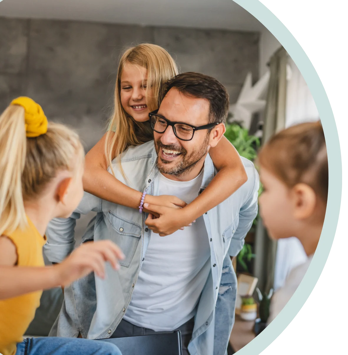 A father with his 3 daughters smiling together